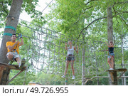 on the ropes in adventure park. Стоковое фото, агентство Ingram Publishing / Фотобанк Лори