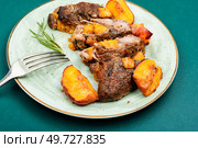 Grilled beef meat steak with peach in fruit marinade. Barbecue. Roasted meat beef steak with peach. Стоковое фото, агентство Ingram Publishing / Фотобанк Лори