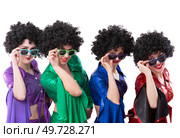 Disco style girls in colorful flared suits and African American wigs on a white background. Seventies or eighties style. Стоковое фото, фотограф Лазаренко Светлана / Фотобанк Лори