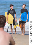 body boarders surf on beach. Стоковое фото, агентство Ingram Publishing / Фотобанк Лори