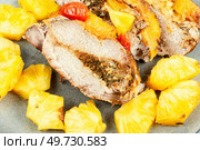 Appetizing meat roasted with fresh pineapple. Cuban food. Pork meat baked with pineapple. Стоковое фото, агентство Ingram Publishing / Фотобанк Лори