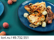 Slice of baked chicken meat with lychee on a plate.. Plate of chicken roasted with lychee. Стоковое фото, агентство Ingram Publishing / Фотобанк Лори
