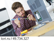 soldering a pc board. Стоковое фото, агентство Ingram Publishing / Фотобанк Лори