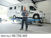 working in a campervan garage. Стоковое фото, агентство Ingram Publishing / Фотобанк Лори