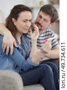 sad couple after negative pregnancy test result. Стоковое фото, агентство Ingram Publishing / Фотобанк Лори