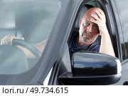 male driver get bored trapped in traffic jam. Стоковое фото, агентство Ingram Publishing / Фотобанк Лори