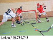 men playing a hockey game. Стоковое фото, агентство Ingram Publishing / Фотобанк Лори