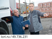 trucks driver with tradesman in factory stock. Стоковое фото, агентство Ingram Publishing / Фотобанк Лори
