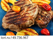 Appetizing grilled meat,roasted with pineapple. Grilled steak and ananas. Close up. Macro.. Grilled meat steak with ananas. Стоковое фото, агентство Ingram Publishing / Фотобанк Лори