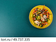 Salad of cucumber, onion and octopus. Korean food. Korean cuisine with seafood. Copy space.. Cucumber and octopus salad. Стоковое фото, агентство Ingram Publishing / Фотобанк Лори