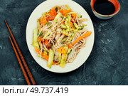 Vegan salad with enoki mushrooms, carrots, cucumber, fried sesame seeds. Asian cuisine.. Enoki mushroom spicy salad. Стоковое фото, агентство Ingram Publishing / Фотобанк Лори