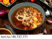 Tasty soup with meat on the table. Traditional Ukrainian Russian borshch.. Traditional soup borscht in bowl. Стоковое фото, агентство Ingram Publishing / Фотобанк Лори