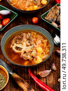 Tasty borshch, soup with meat on the table. Traditional Ukrainian Russian borscht.. Delicious homemade borscht or soup. Стоковое фото, агентство Ingram Publishing / Фотобанк Лори