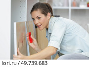 woman with wooden furniture at home. Стоковое фото, агентство Ingram Publishing / Фотобанк Лори