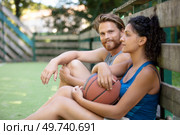couple having a break after match. Стоковое фото, агентство Ingram Publishing / Фотобанк Лори