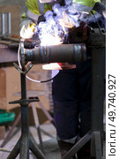 metal welding with sparks and smoke. Стоковое фото, агентство Ingram Publishing / Фотобанк Лори