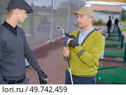 training golf ball with bucket on rough grass. Стоковое фото, агентство Ingram Publishing / Фотобанк Лори