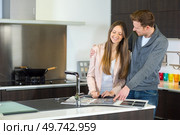 young happy couple willing to buy new kitchen. Стоковое фото, агентство Ingram Publishing / Фотобанк Лори