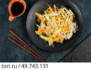 Salad with enoki mushrooms, carrots, cucumber and fried sesame seeds. Food, salad.. Salad with enoki mushrooms, Asian cuisine. Стоковое фото, агентство Ingram Publishing / Фотобанк Лори