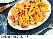 Appetizing macaroni or pasta boiled with octopus. Pasta with seafood.. Pasta, macaroni with octopus pieces. Стоковое фото, агентство Ingram Publishing / Фотобанк Лори