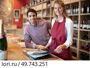 sommelier with his student in wine cellar. Стоковое фото, агентство Ingram Publishing / Фотобанк Лори
