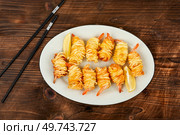 Roasted rolled potato shrimps, prawns and potato rolls. Top view. Asian food.. Noodles rolls with prawn, Vietnamese cuisine. Стоковое фото, агентство Ingram Publishing / Фотобанк Лори