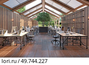 A large open office space with wooden floors . The space is filled with desks and chairs, and there are several potted plants scattered throughout the room. A large open office space with wooden floors. Стоковое фото, агентство Ingram Publishing / Фотобанк Лори