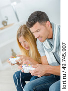 couple is playing video game. Стоковое фото, агентство Ingram Publishing / Фотобанк Лори