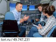 conversation in the aircraft simulator. Стоковое фото, агентство Ingram Publishing / Фотобанк Лори