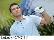 pro golf player shot ball from sand bunker at course. Стоковое фото, агентство Ingram Publishing / Фотобанк Лори