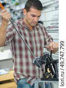 a golfer repairing his club. Стоковое фото, агентство Ingram Publishing / Фотобанк Лори