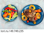 Yummy grilled meat,roasted with pineapple. Grilled steak and ananas, bbq. Top view.. Grilled pork chop steak with ananas. Стоковое фото, агентство Ingram Publishing / Фотобанк Лори