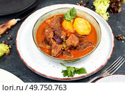 Appetizing goulash made from venison meat, meat goulash with potatoes in a bowl.. Venison goulash or deer ragout. Стоковое фото, агентство Ingram Publishing / Фотобанк Лори