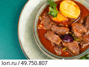Stewed deer goulash in sauce, venison goulash. Wild game meat. Copy space.. Roast venison with potatoes. Стоковое фото, агентство Ingram Publishing / Фотобанк Лори