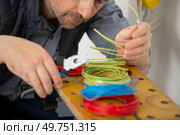 electrician engineer tests electrical installations. Стоковое фото, агентство Ingram Publishing / Фотобанк Лори