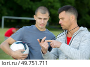 a football coaching and footballer. Стоковое фото, агентство Ingram Publishing / Фотобанк Лори