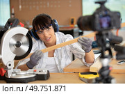 female diy blogger recording video of woorworking hobby. Стоковое фото, агентство Ingram Publishing / Фотобанк Лори