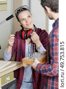 female worker choosing correct sized drill bit. Стоковое фото, агентство Ingram Publishing / Фотобанк Лори