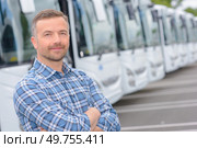Portrait of man with fleet of buses. Стоковое фото, агентство Ingram Publishing / Фотобанк Лори