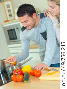 a couple is cooking lunch. Стоковое фото, агентство Ingram Publishing / Фотобанк Лори