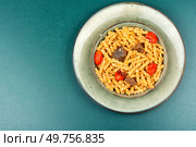 Pasta with beef and vegetables on table. Copy space.. macaroni with meat. Стоковое фото, агентство Ingram Publishing / Фотобанк Лори