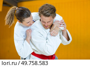 man and woman during karate training. Стоковое фото, агентство Ingram Publishing / Фотобанк Лори