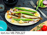 Delicious smoked capelin fish on a plate. Smoked dry capelin. Стоковое фото, агентство Ingram Publishing / Фотобанк Лори