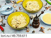 Vegetarian lunch, pearl or millet porridge with wild mushrooms.. Mushroom porridge for breakfast. Стоковое фото, агентство Ingram Publishing / Фотобанк Лори