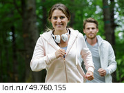 girl in sportswear on a run in the forest. Стоковое фото, агентство Ingram Publishing / Фотобанк Лори