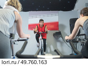People training on static cycles. Стоковое фото, агентство Ingram Publishing / Фотобанк Лори