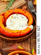 Autumn pumpkin baked with camembert cheese on a rustic wooden table. Healthy food.. Pumpkin baked with cheese. Стоковое фото, агентство Ingram Publishing / Фотобанк Лори
