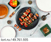 Delicious octopus dish, grilled octopus on skewers. Skewers of squid tentacles, octopus.. Grilled Octopus Skewers. Стоковое фото, агентство Ingram Publishing / Фотобанк Лори