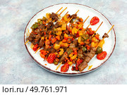 Kebabs or lamb mutton shish kebab on a wooden skewer.. Traditional Turkish grilled lamb shish kebab or kebap. Стоковое фото, агентство Ingram Publishing / Фотобанк Лори
