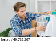 repairman fixing electronic devices. Стоковое фото, агентство Ingram Publishing / Фотобанк Лори